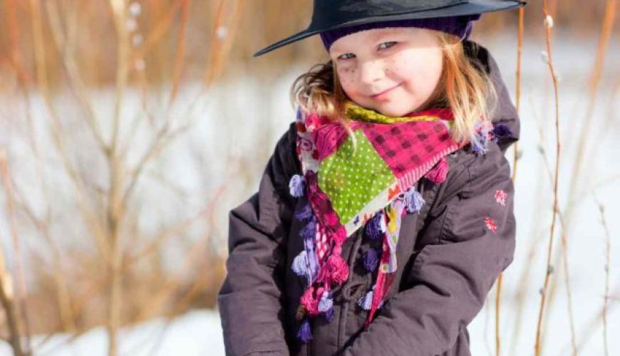 Girl kid of Finland standing on snow