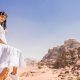Girl enjoying the scenic rock formations at Wadi Rum on the 5 nights 6 days Jordan tour package