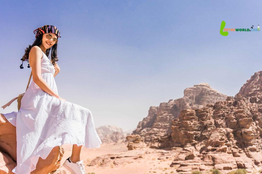 Girl enjoying the scenic rock formations at Wadi Rum on the 5 nights 6 days Jordan tour package