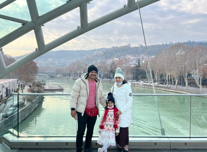 A UAE family posing in front of a bridge in Tbilisi, Georgia as part of their 5 days Georgia tour package.