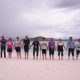 Group Enjoying on Pink beach, while on thier 1 day komodo Island tour from Labuan Bajo