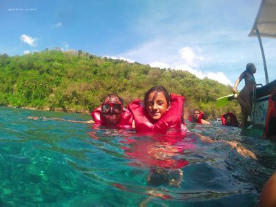 Nusa Penida Island images of travellers3 Child floating on Water while doing Snorkelling at Nusa Penida island