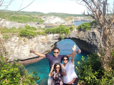 Nusa Penida Island images of travellers4 A family of tourists enjoying at Broken beach of Nusa Penida Island.