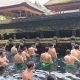 Tourists taking holy bath in natural spring water at Tirta Emphul temple