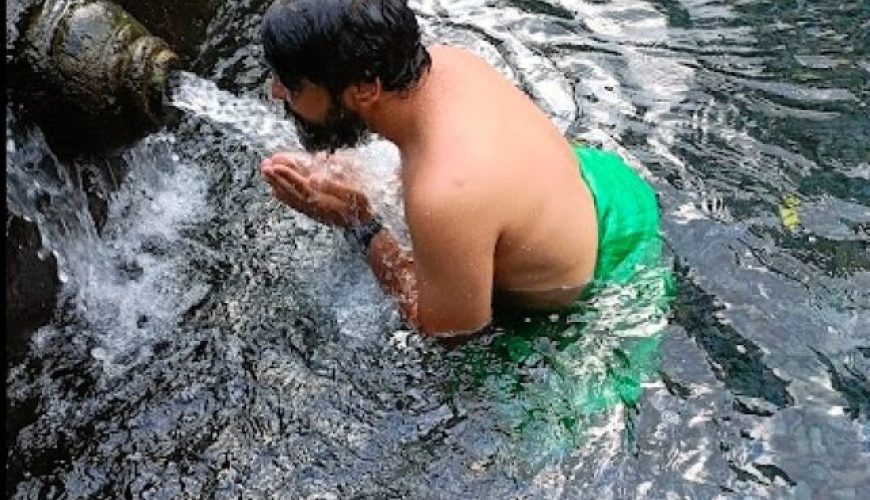 Adit Sarin taking bath in Holy water coming from natural spring at Tirta Emphul temple
