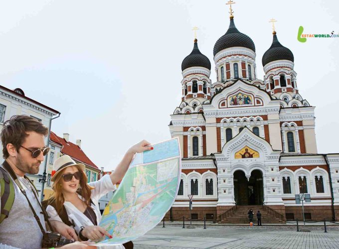 A couple stands in front of the Alexander Nevsky Cathedral in Tallinn, Estonia, looking at a map during their 10 nights 11 days tour across Iceland, Norway, Sweden, Estonia, and Finland.
