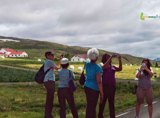 A group of tourists standing at Akureyri Land Point during their 11 nights 12 days Iceland, Norway, Sweden & Finland tour package.