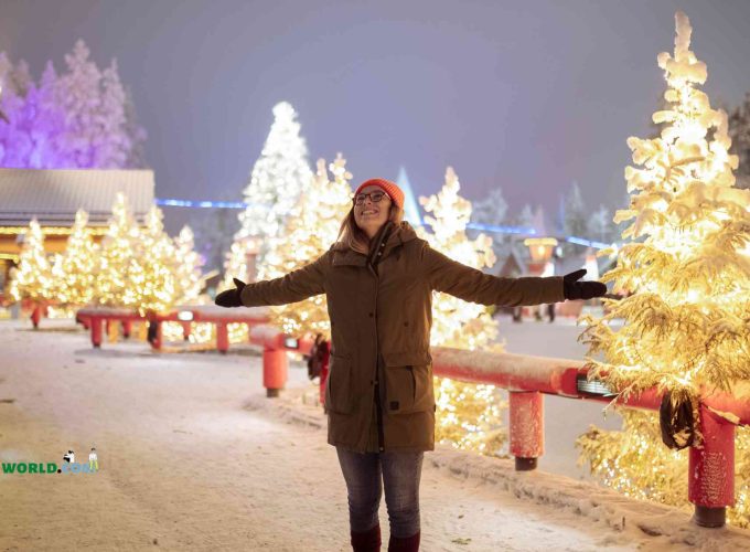 Rubina from Singapore embraces the winter magic in Rovaniemi, Finland, during a group tour on Christmas with Lestacworld.com