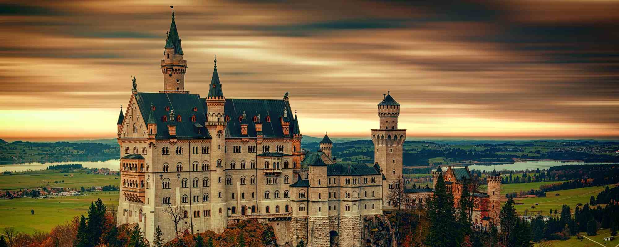 Neuschwanstein Castle surrounded by lush greenery. 10 Best Germany tour packages