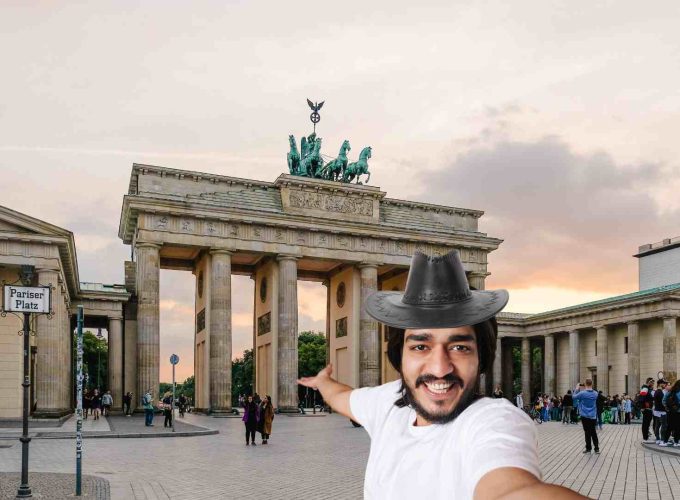 Tourist taking a selfie in front of the quadriga on the Brandenburg Gate