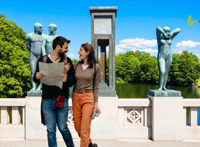 Tourists joyfully exploring Frognerparken park in Oslo during their memorable 7 nights 8 days Scandinavia tour package booked through Lestacworld.