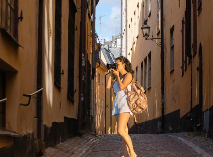 Tourist standing on Oslo road, exploring the city's charm after booking a 9 nights 10 days Scandinavia tour package from Lestacworld.com.