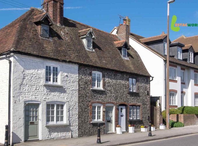 Old and modern houses in London, representing the charm of England.