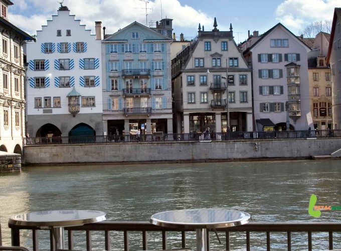 Old city clicks of Zurich with river-sided hotels, a highlight of the 5 nights 6 days Switzerland tour package.