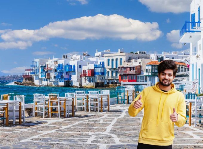 Tourist men posing at the streets of Santorini during an 8 nights 9 days Greece tour package.