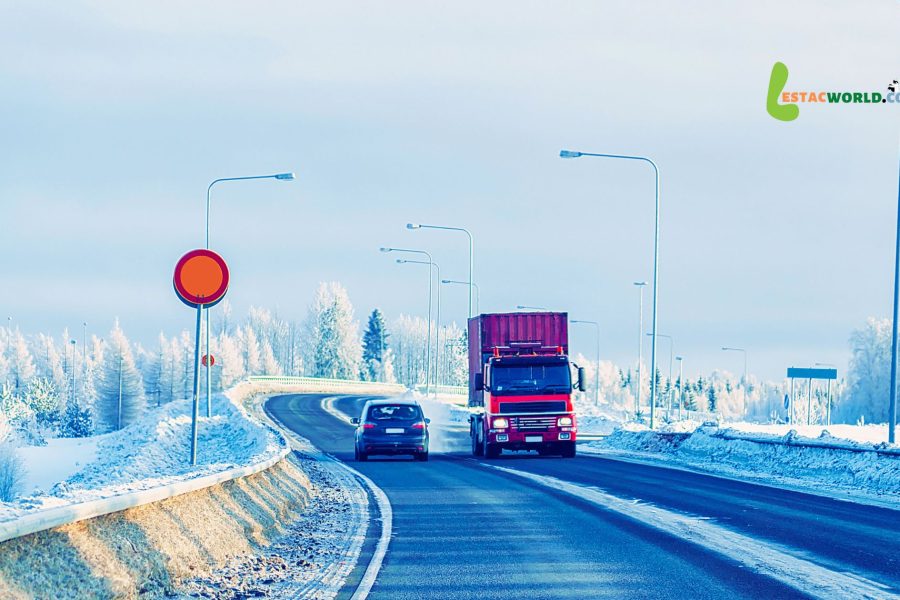 A serene road winding through the snowy landscape of Lapland, symbolizing the picturesque journey from Ivalo to Kiruna via cab transfers.