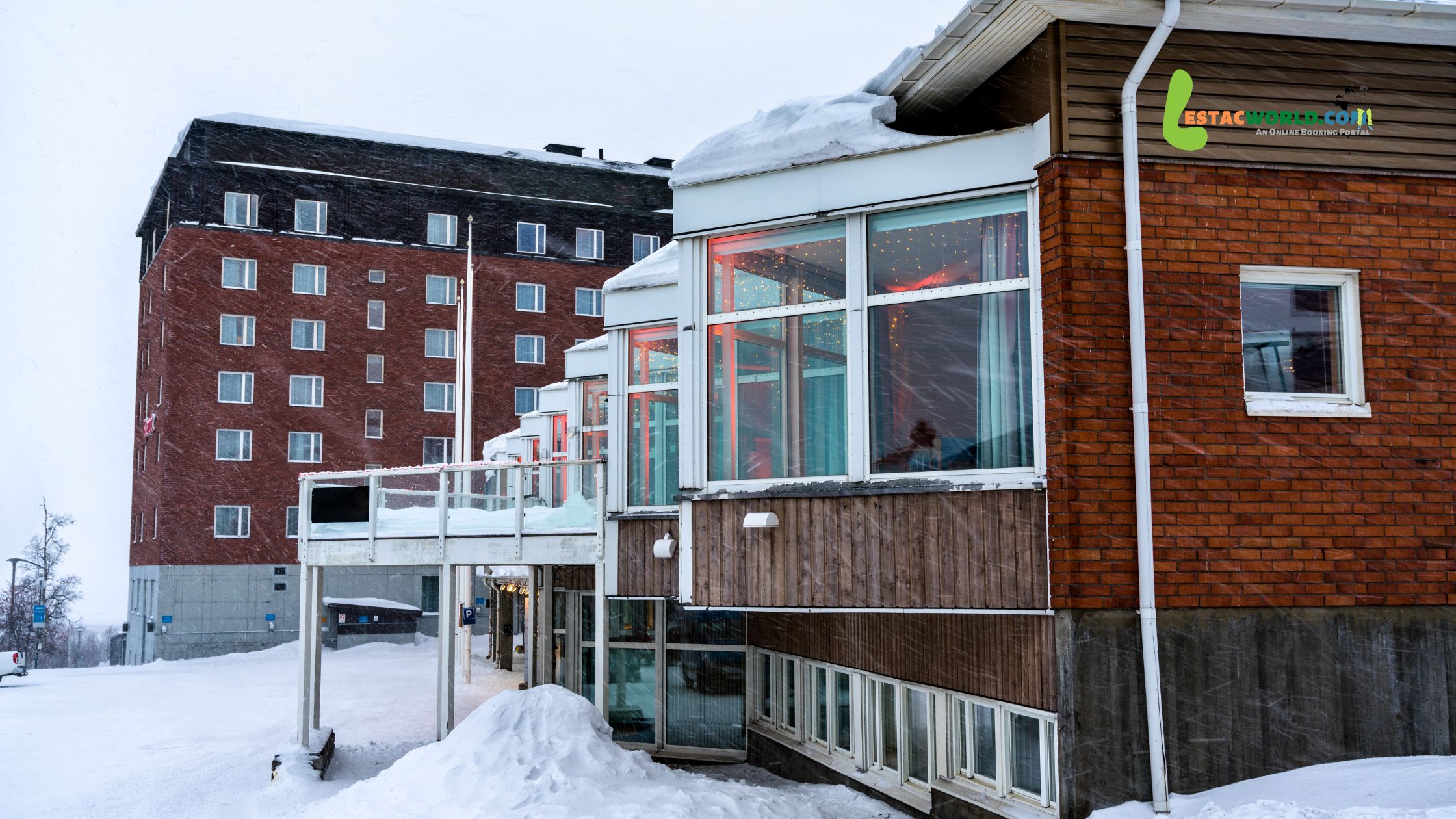 Ice Hotel's outer building covered in snow in November.