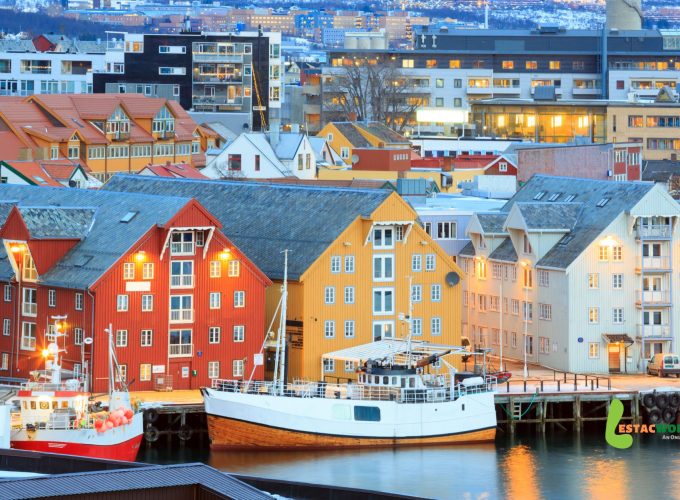 Colorful Tromsø hotels with boat access along the waterfront.