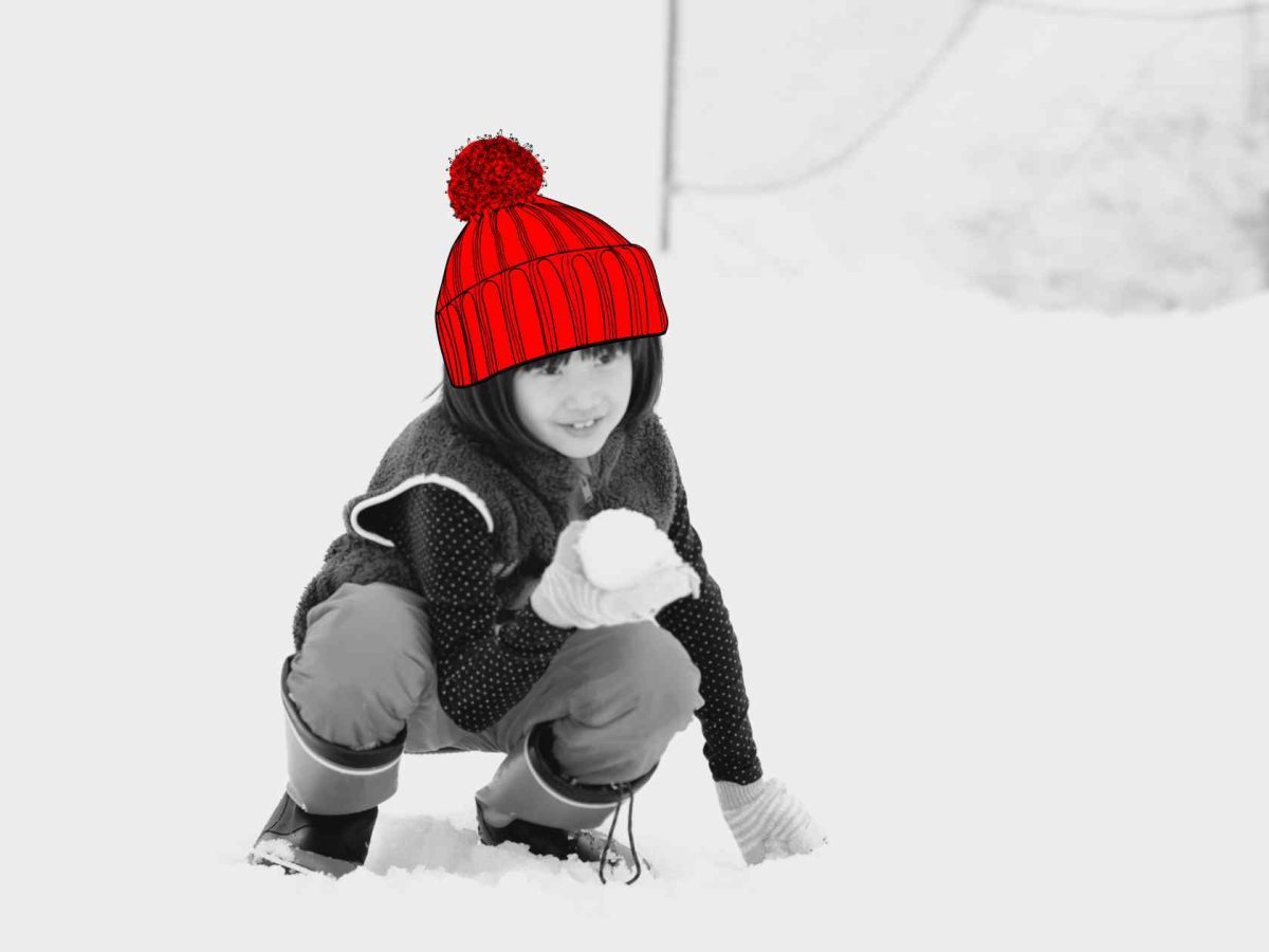 A young girl named Pamela, daughter of Ling Zhang and Ron, joyfully playing in the snow in Finland.