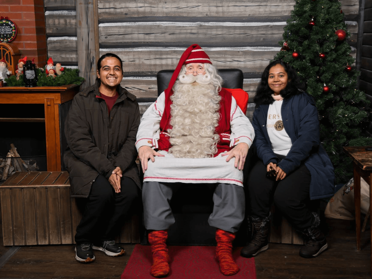 Mr Karan and his wife woth Santa claus village in Rovaniemi, Finland