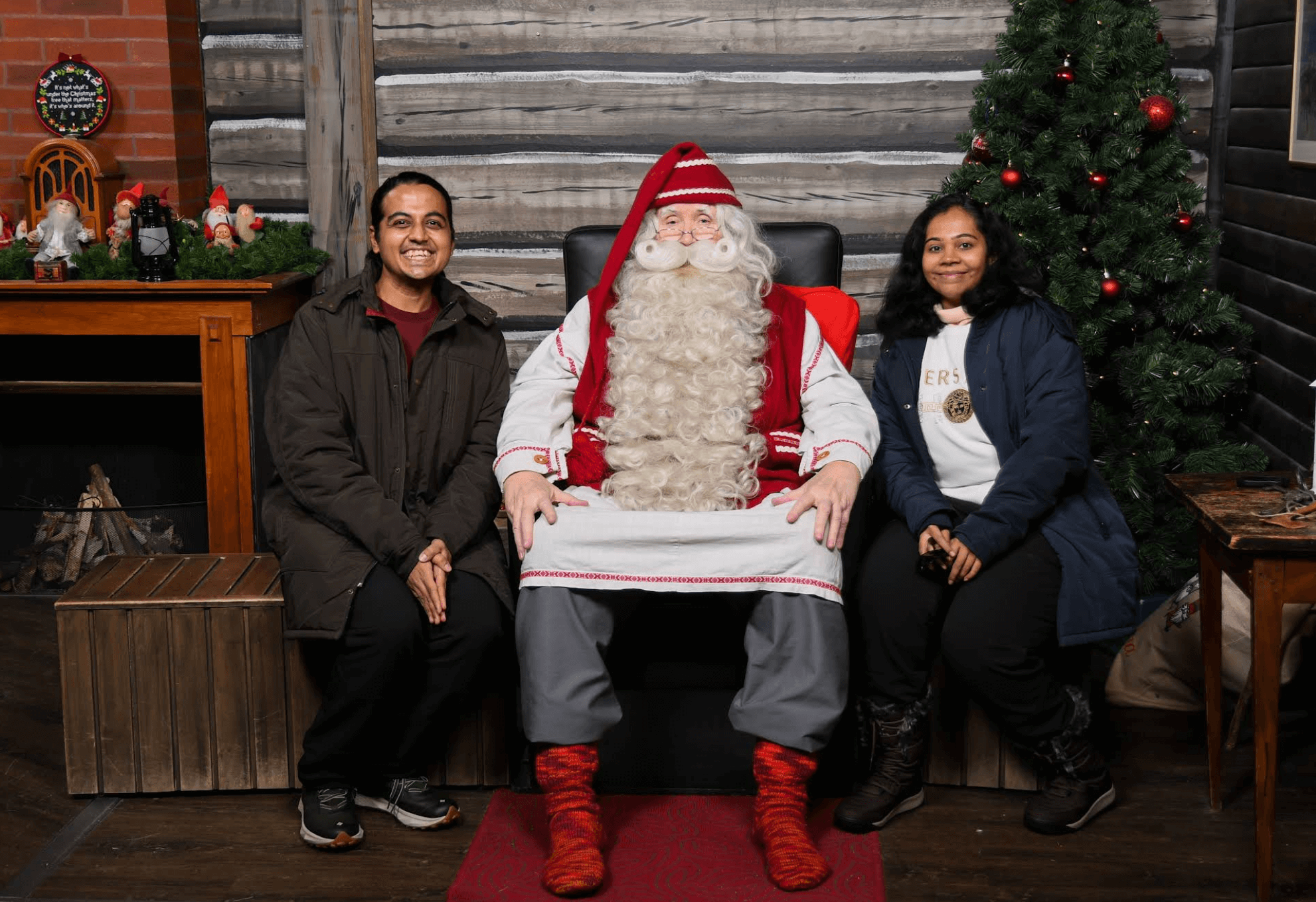 Mr Karan and his wife woth Santa claus village in Rovaniemi, Finland