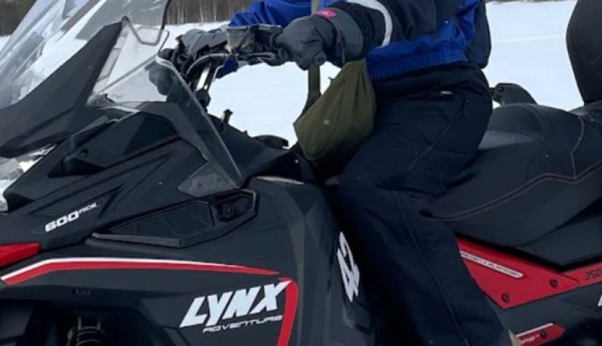 Ms Yen enjoying Snowmobile Safari during her Solo Finland northern lights tour